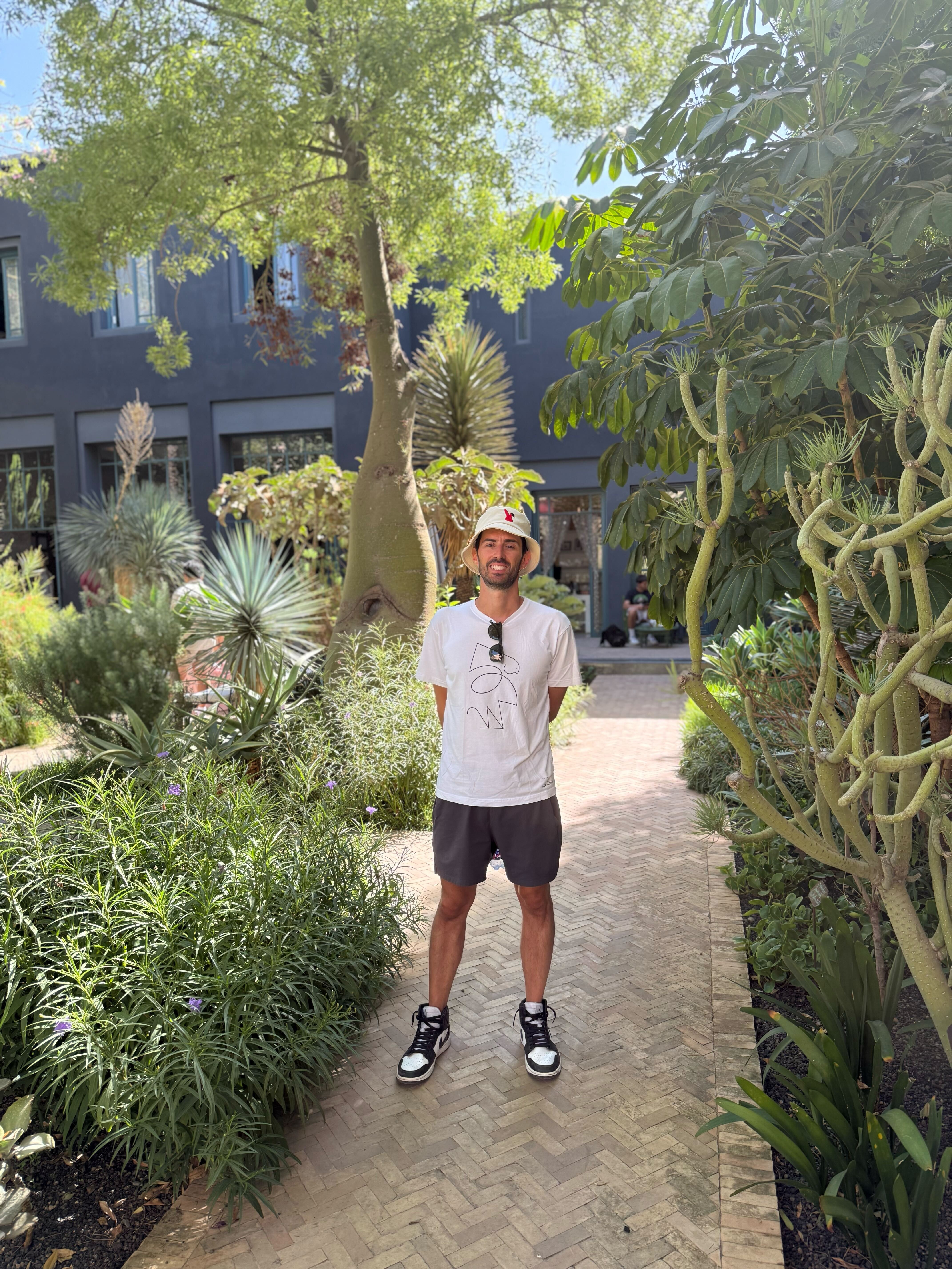 Kyle Libra walking through a garden