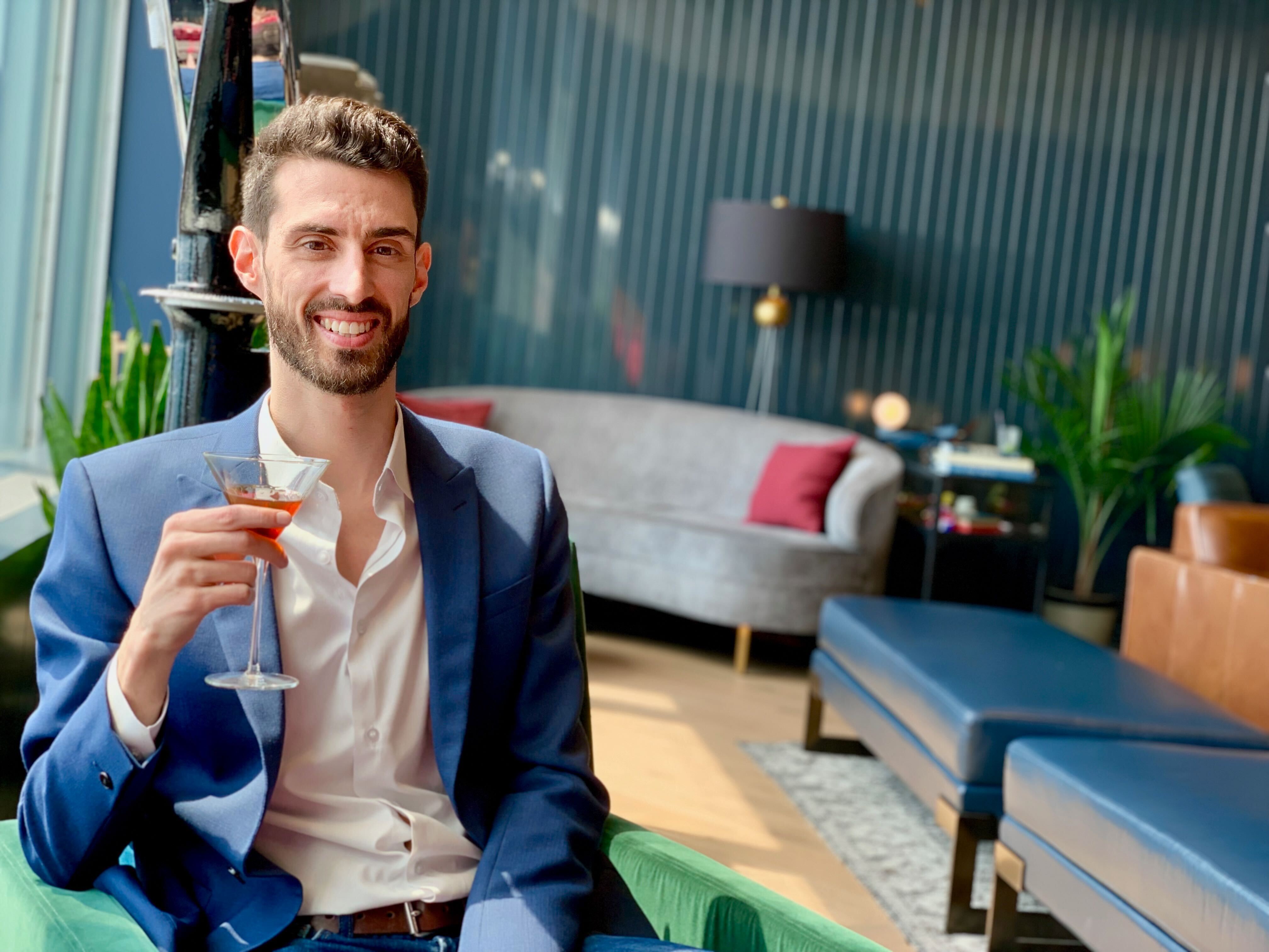 Kyle Libra drinking a martini